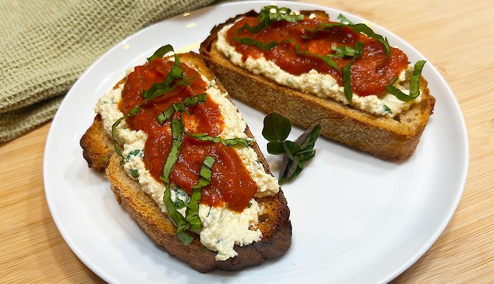 Plant Based Vegan Whipped Ricotta Toasts with Roasted Red Gravy and Basil
